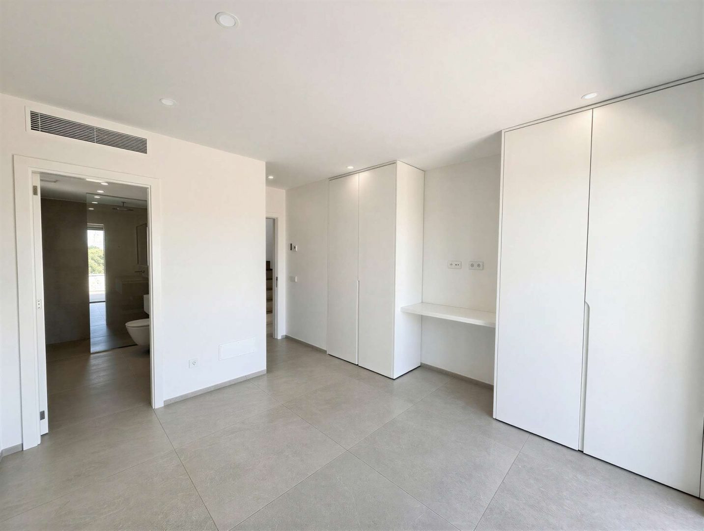 Primary bedroom with en-suite bathroom